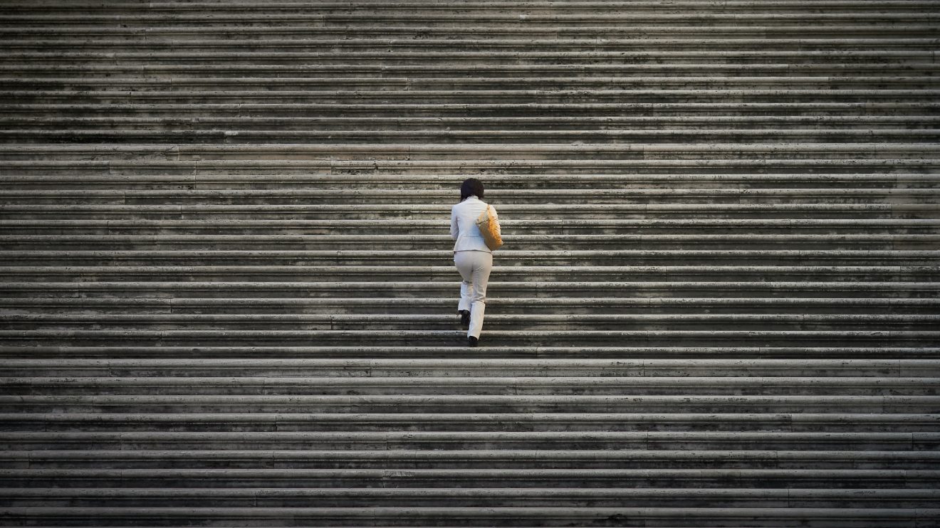 This image shows a person walking up stairs.