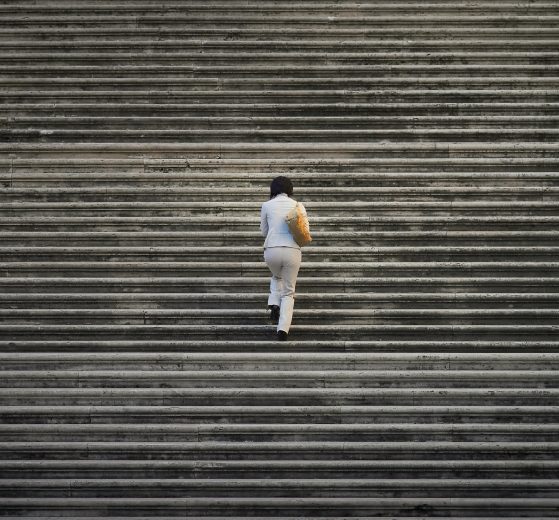 This image shows a person walking up stairs.