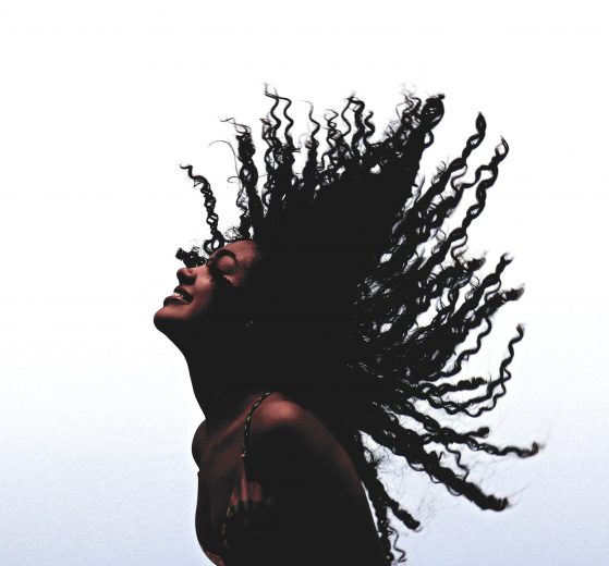 Woman tossing curls