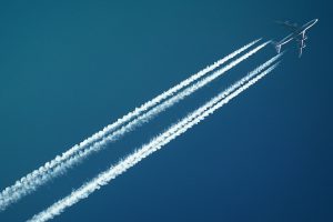 A photo of a plane moving across the sky, representing accelerating change for women in investment