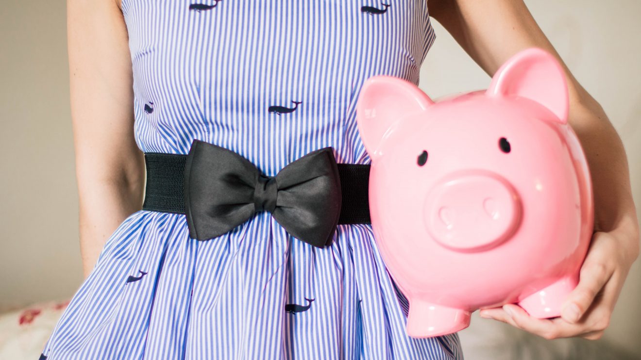 Woman holding piggy bank fund