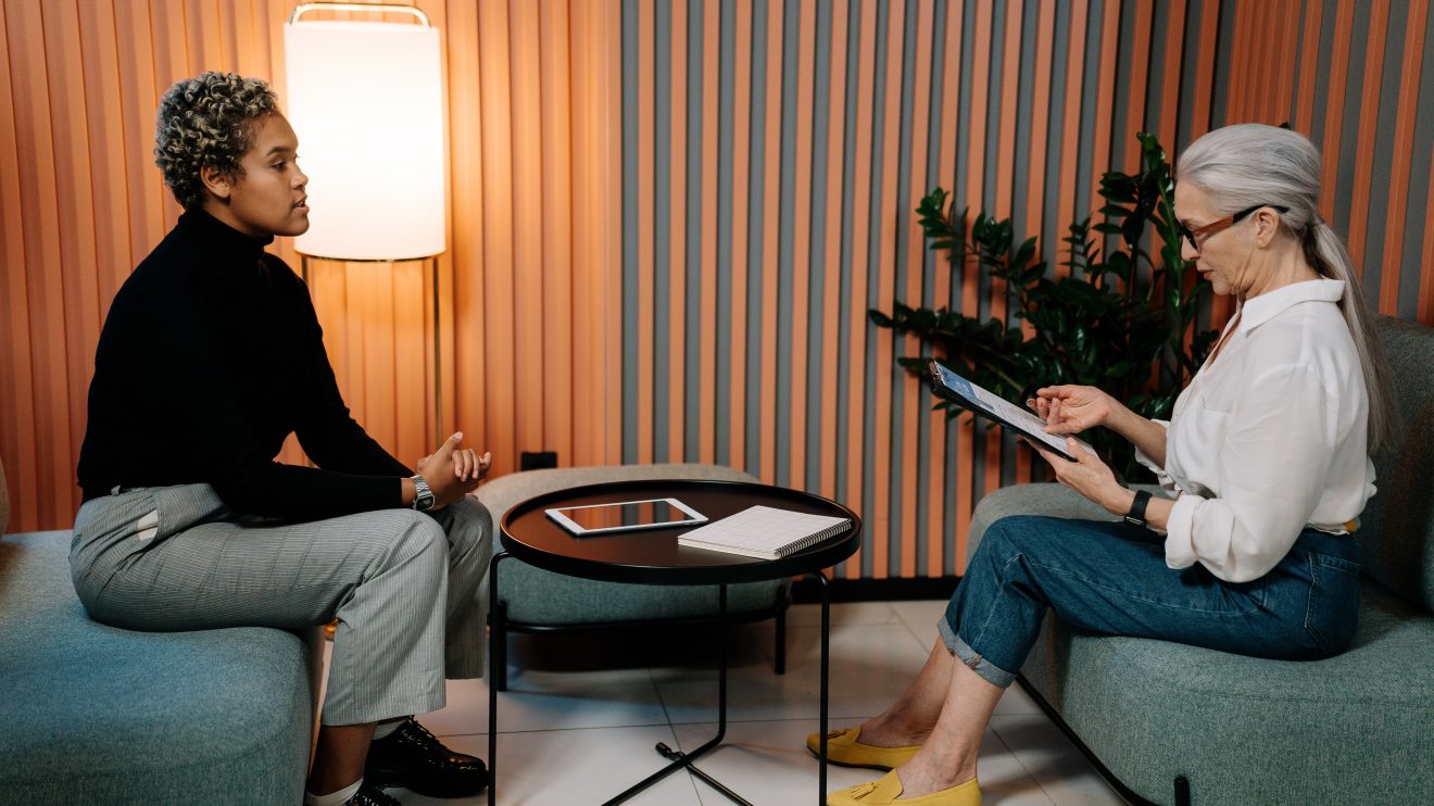 Two women sitting down for an interview
