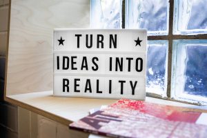 A sign that says "Turn ideas into reality"