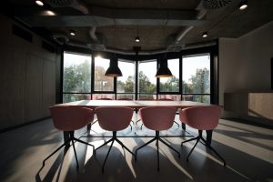 Boardroom with pink chairs