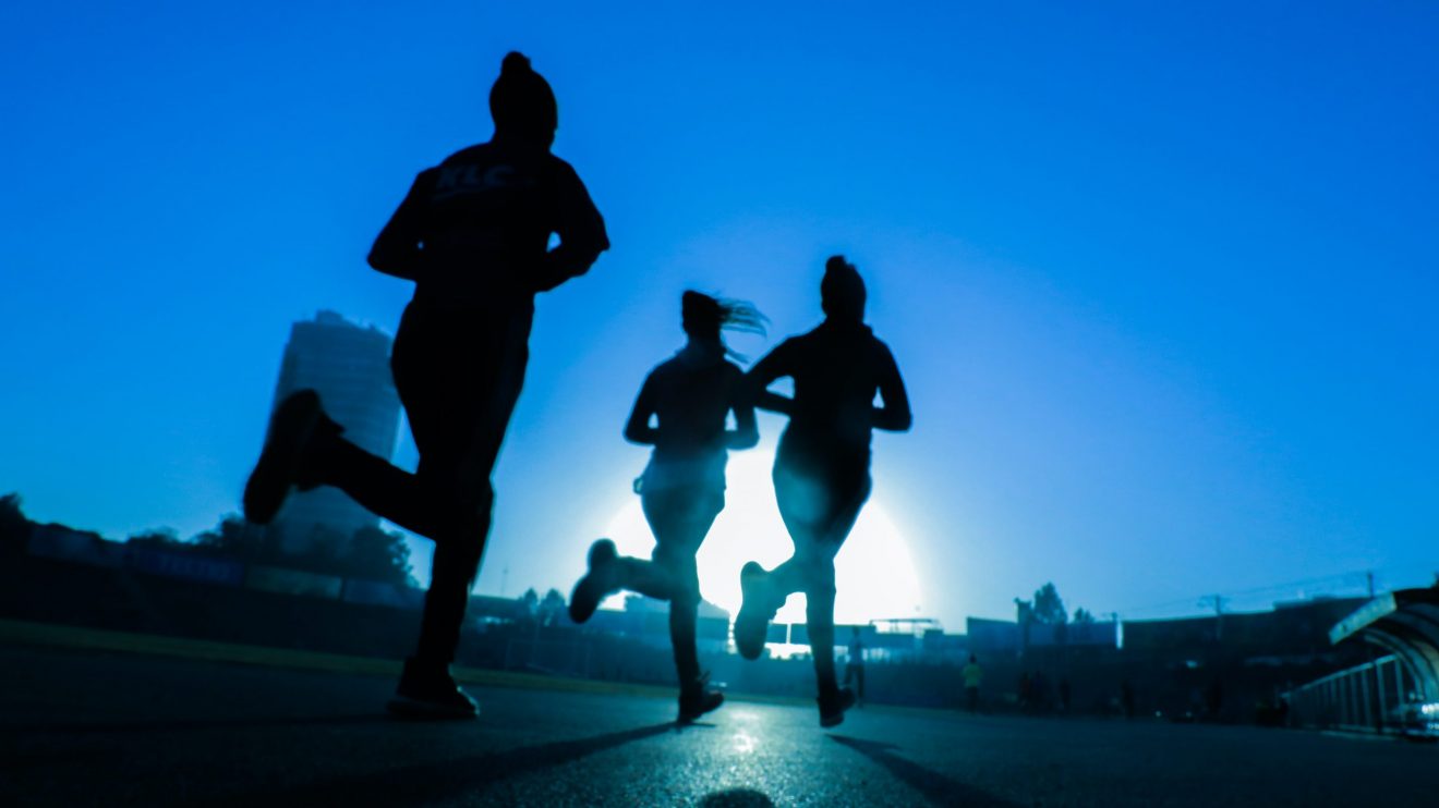 A photo of women jogging, representing starting a business