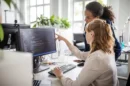 women working together on computer