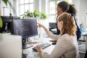 women working together on computer