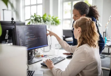 women working together on computer